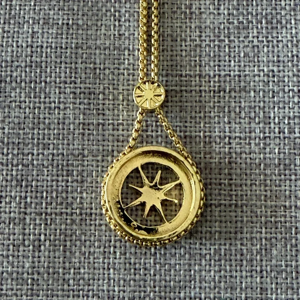 Gold Tone Compass Starburst Pendant Necklace with Crystal Halo